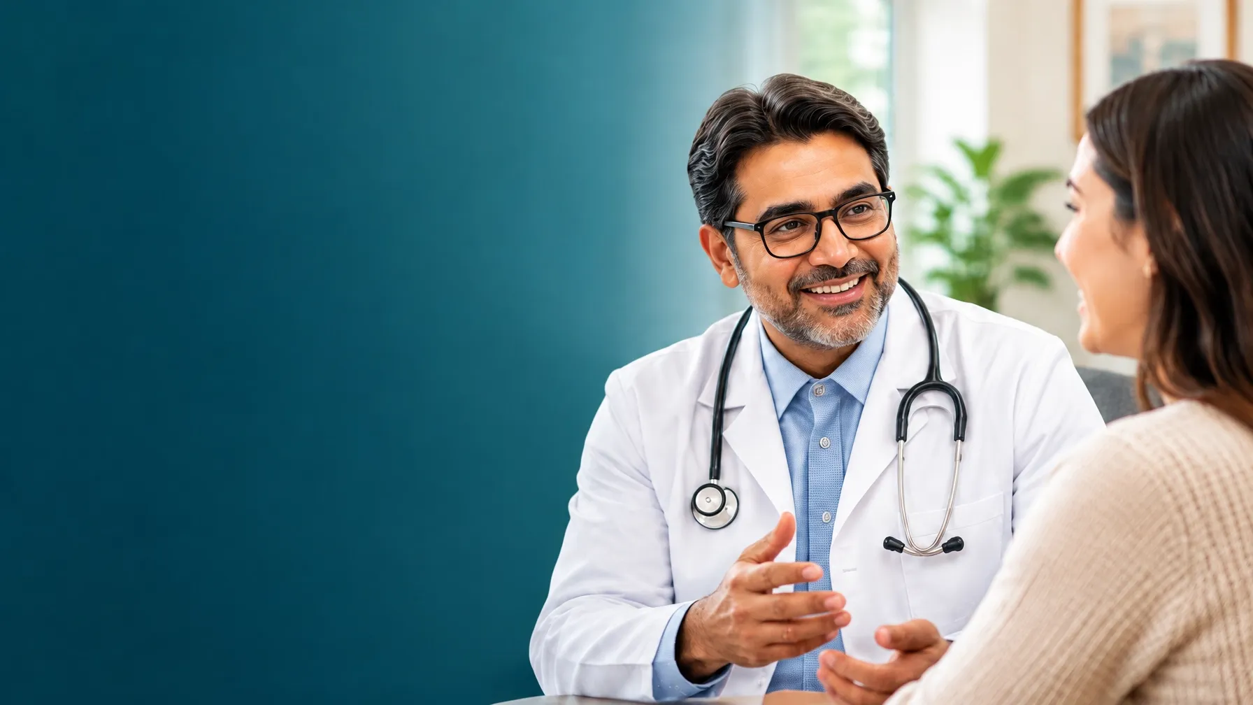 Dr. Rizvi speaking warmly with a patient during a clinic visit